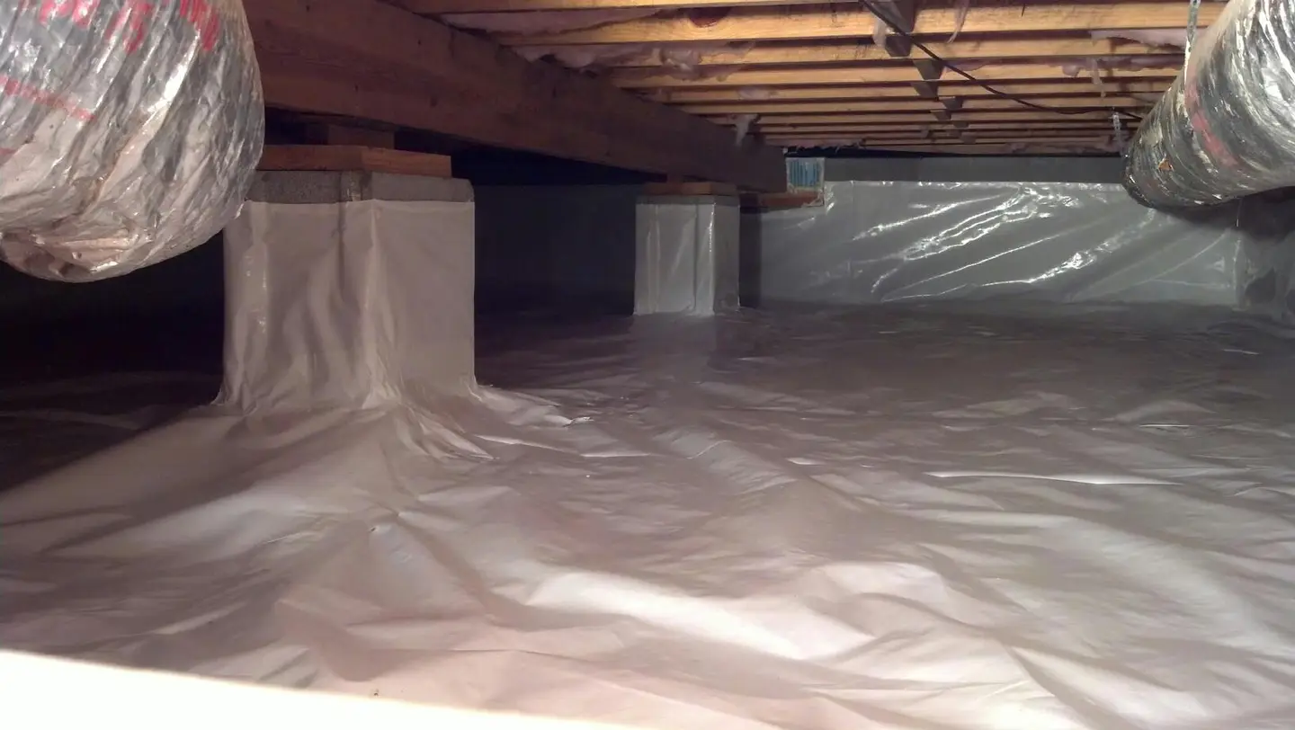 Ground Up Foundation Repair, Waterproofing and Concrete Leveling installing a full crawl space encapsulation system