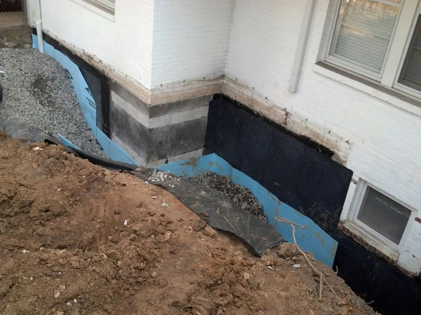 Ground Up Foundation Repair, Waterproofing and Concrete Leveling installing exterior waterproofing membranes and French