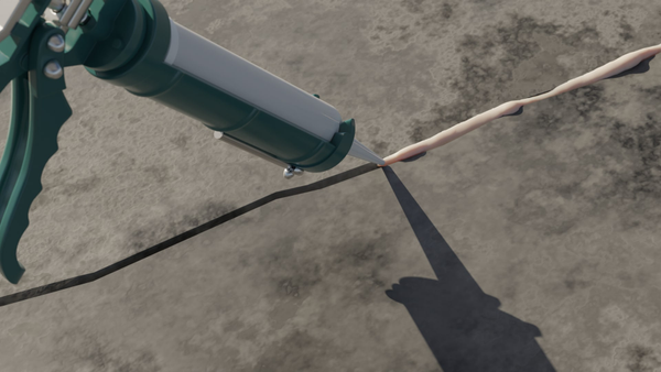 Applying sealant for concrete crack repair.