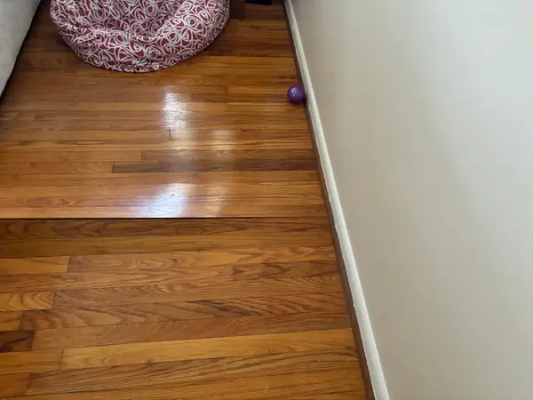 Sagging hardwood floors caused by foundation settlement.