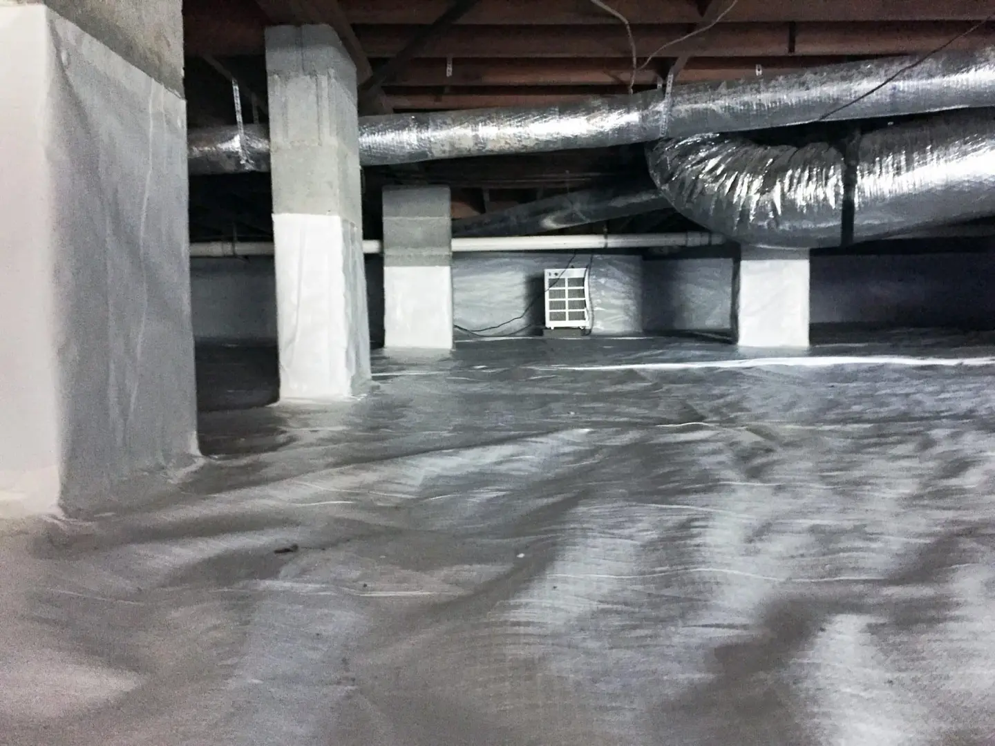 Ground Up Foundation Repair, Waterproofing and Concrete Leveling completing a crawl space encapsulation with a new vapor