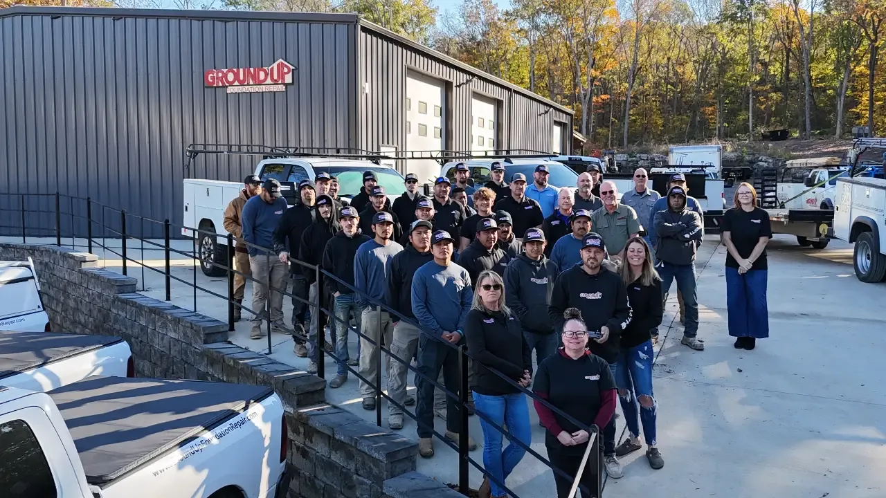Ground Up Foundation Repair team members posing together in front of the company office in Murfreesboro.