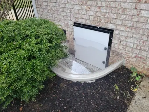 Ground Up Foundation Repair, Waterproofing and Concrete Leveling installing a new crawl space access door and access well.