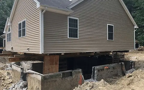 Ground Up Foundation Repair, Waterproofing and Concrete Leveling preparing a new foundation under a lifted house.